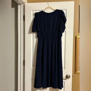 Short sleeved, navy blue dress.